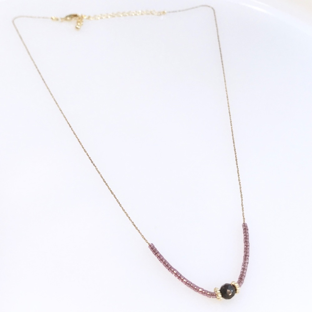 Gold chain necklace with purple stone pendant